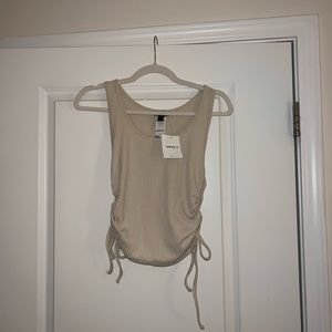 Cream shirt with ties on the side size medium